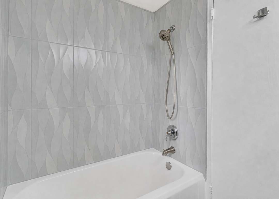 Tiled tub surround with handheld shower