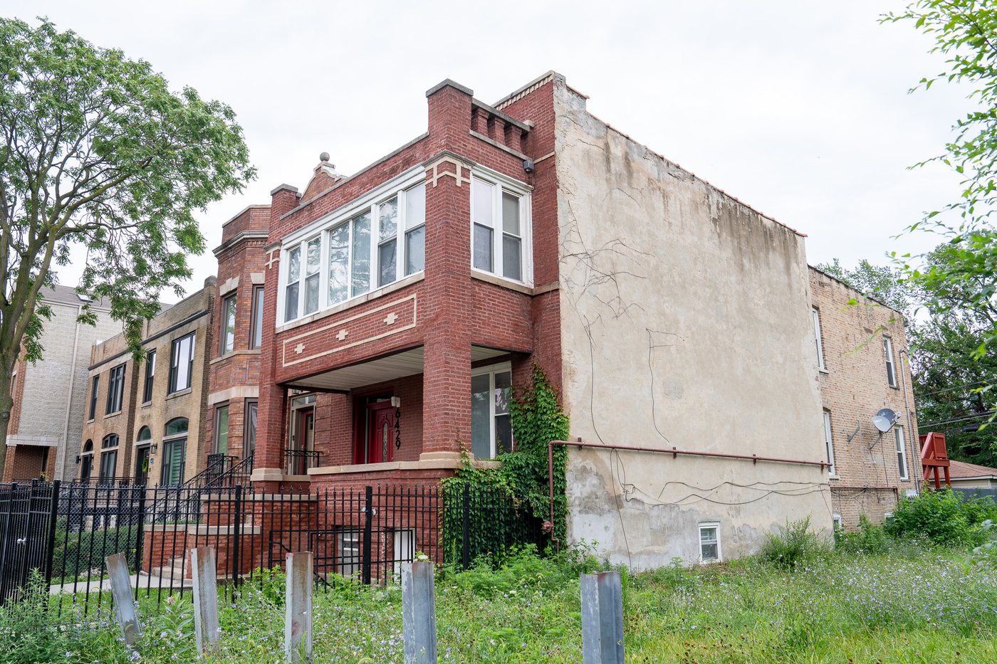 Brick two-flat exterior with front porch