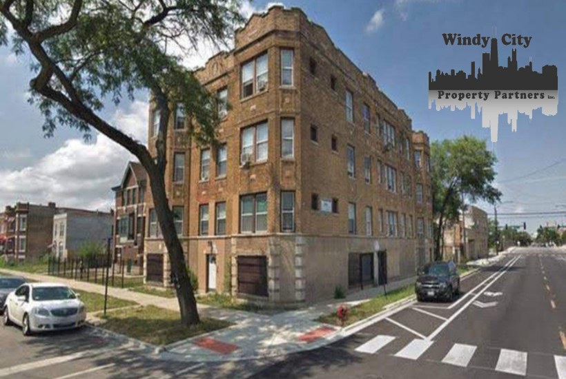 Three-story brick nine-unit apartment building on a Chicago corner